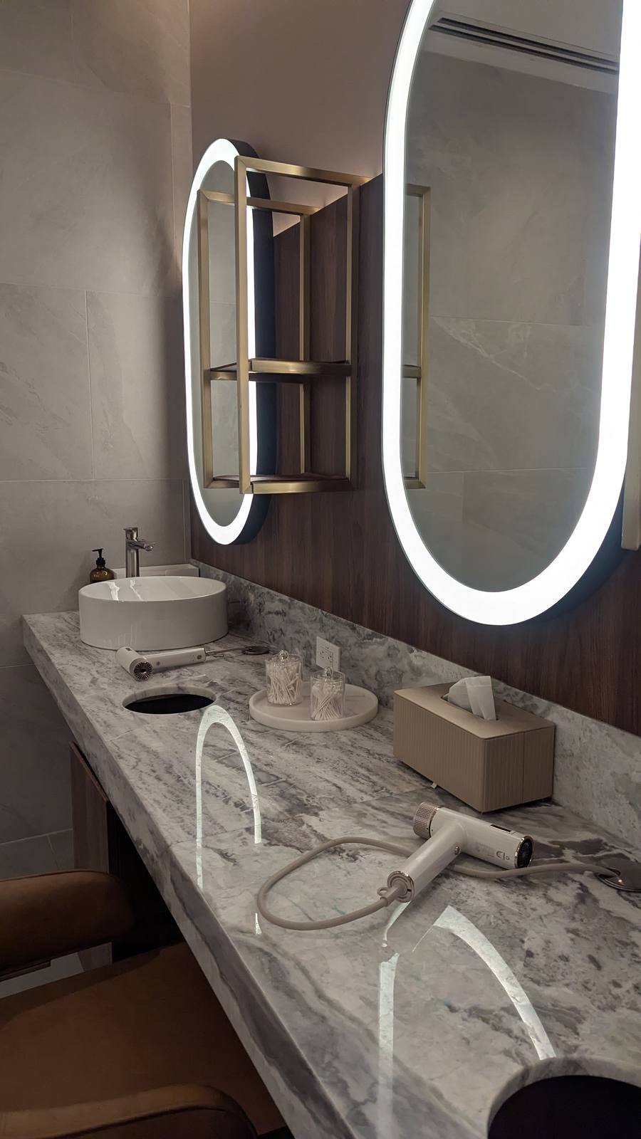 Avant Toronto changeroom, marble vanity counter and oval backlit mirrors