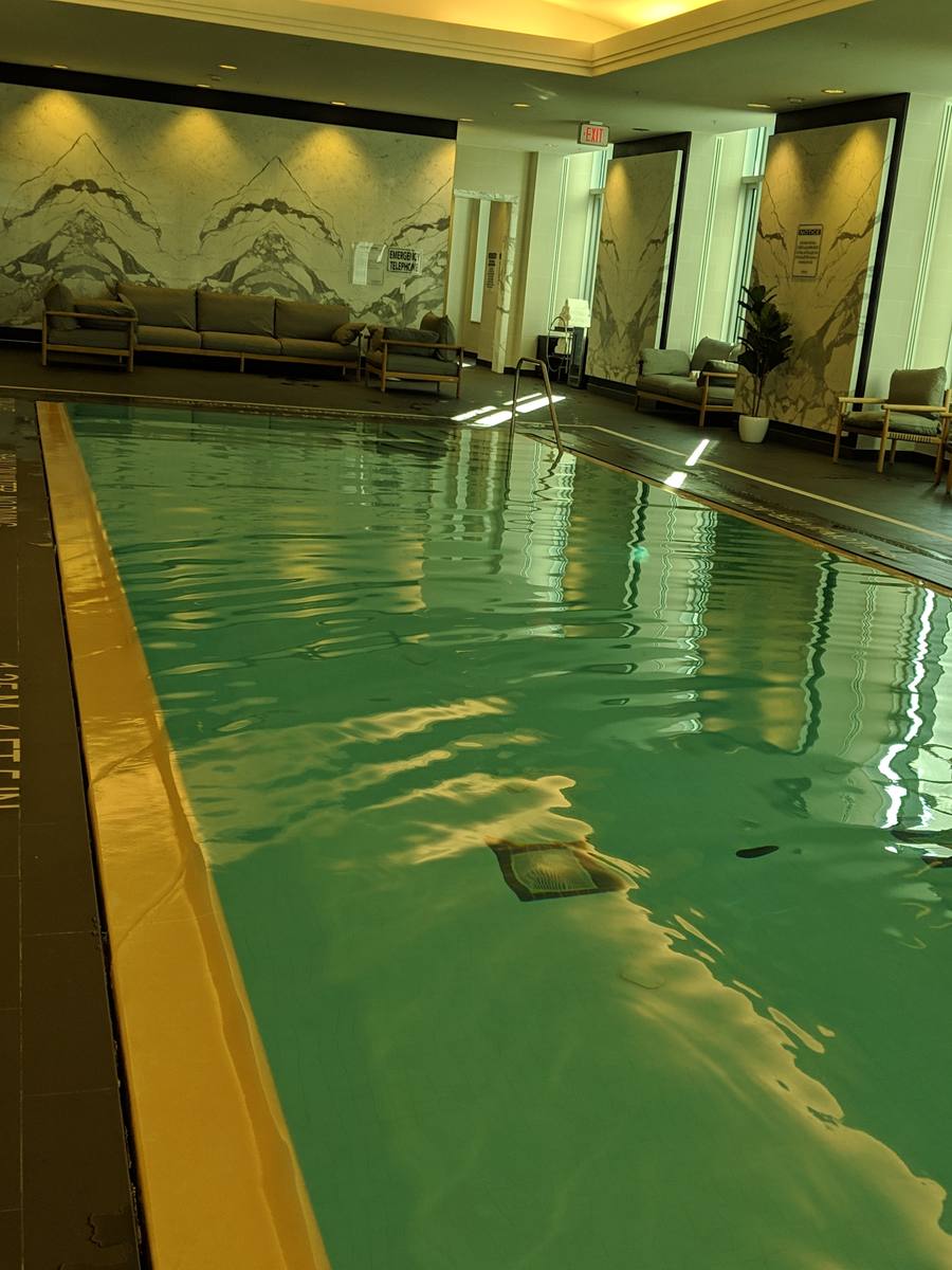 St. Regis Spa Toronto – treatment suite with marble finishes and soft lighting